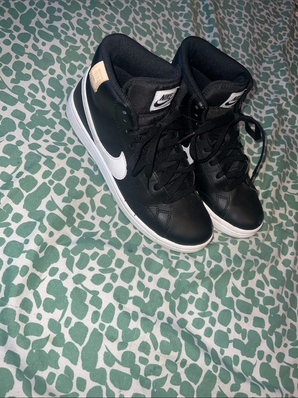 Nike woman’s Black and White High-Top Sneakers